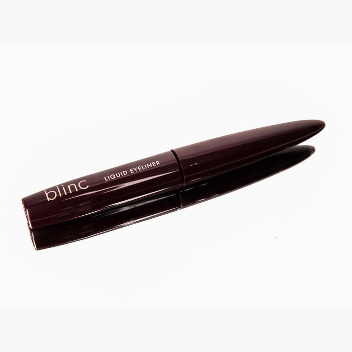 Sleek dark brown liquid eyeliner pen with the label "blinc LIQUID EYELINER" displayed against a white background, showcasing the Liquid Eyeliner - Black | Blinc product.