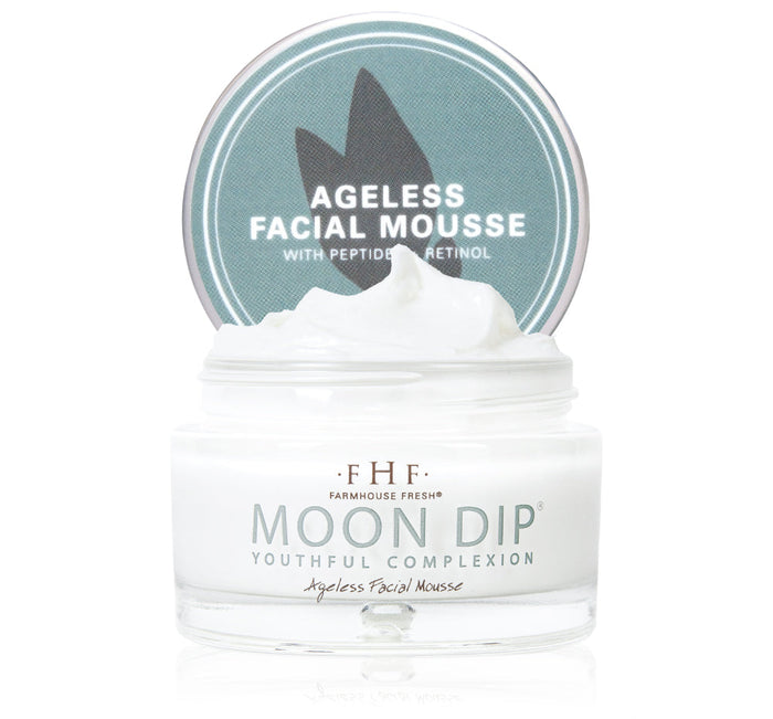 Open jar of Moon Dip® Youthful Complexion Ageless Facial Mousse with Peptides + Retinol | Farmhouse Fresh showing white whipped mousse texture and light blue lid.