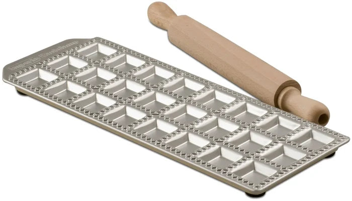 A square ravioli maker with 24 forms, made of aluminum with an enameled steel base and a wooden rolling-pin.