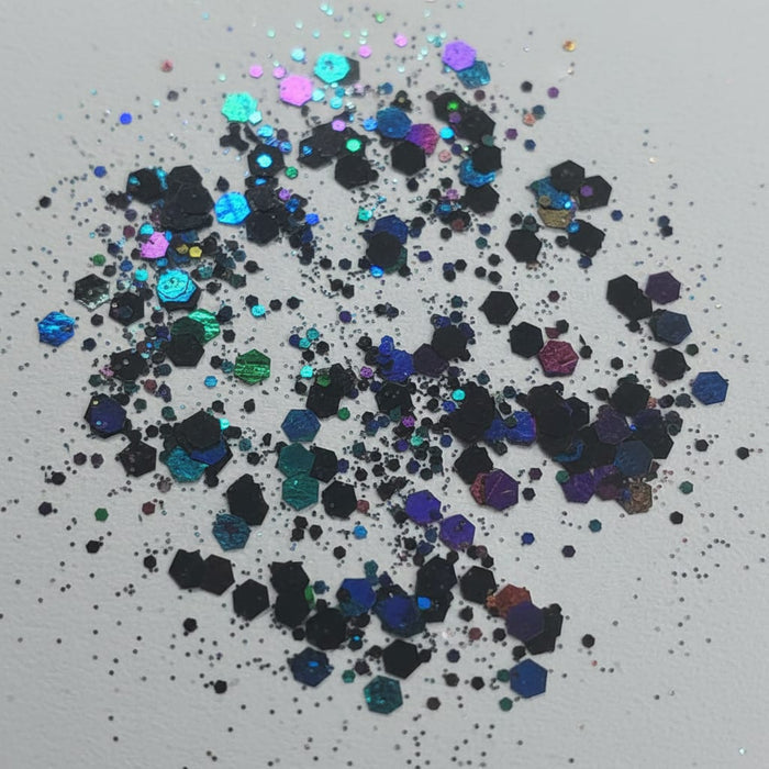 Colorful glitter scattered on a light gray background