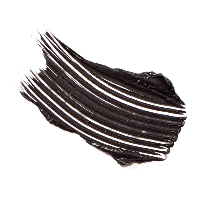 Swatch of rich black mascara texture showing smooth, voluminous strokes representing Beyond Lash Volumizing Mascara | Jane Iredale.