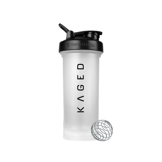 Front view of Blender Bottle Clear with black SpoutGuard lid, carry loop, KAGED logo, and BlenderBall whisk