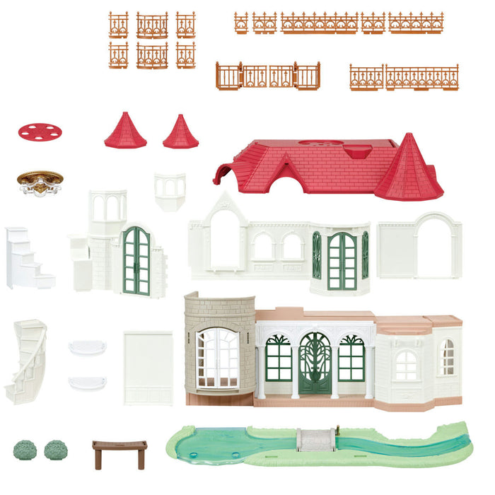 Toy house set with various pieces on a white background