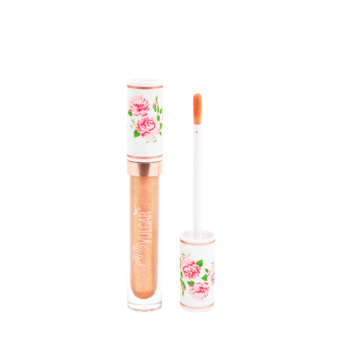 Tube of shimmering peach-toned lip gloss with floral white cap and applicator wand, labeled CEO of Lip Gloss | Pretty Vulgar, displayed on white background.