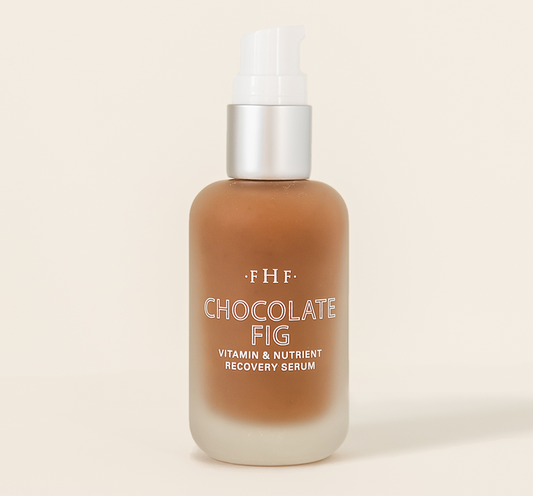 Bottle of Chocolate Fig Vitamin Recovery Serum | Farmhouse Fresh with frosted glass and pump dispenser, showcasing rich brown serum for skincare and wellness routines.