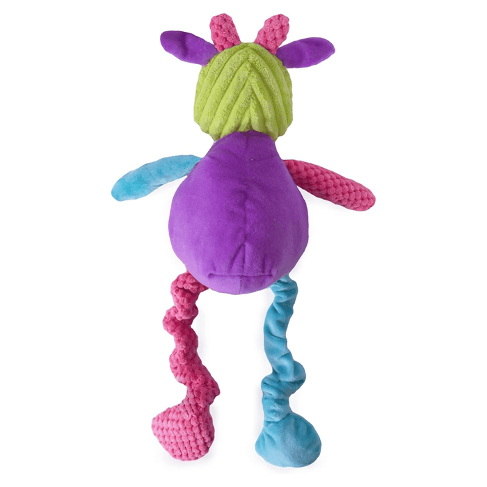Back view of plush cartoon multi-coloured cow dog toy, patches of blue, green, purple and pink all over. Pictured on a white background.