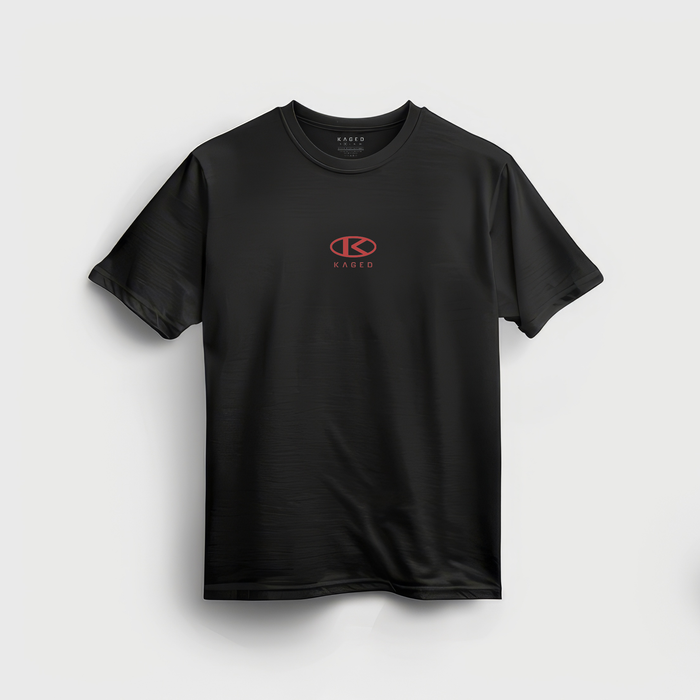 Front view of black Circle Tee crewneck showcasing small red KAGED circle logo centered on chest on gray background #color_black