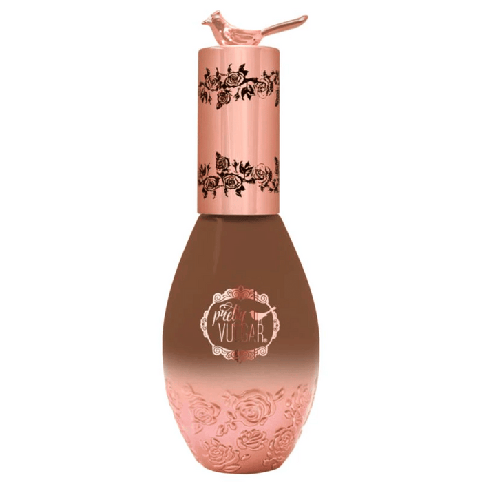 Elegant bottle of Cool AF Lava Water Foundation | Pretty Vulgar with rose gold detailing and a small bird figurine on the cap, designed to enhance skincare and beauty routines.