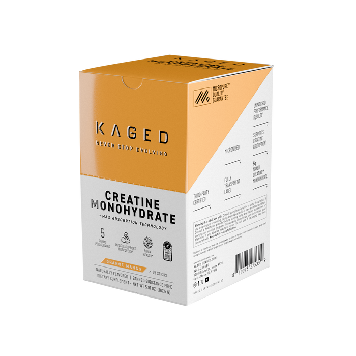 Angled view of Creatine Monohydrate 25-count stick box in orange mango flavor showing KAGED logo and supplement label on black background #flavor_orange mango