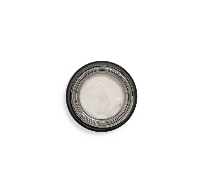 Open jar top view showing a smooth white cream texture of Crow Catcher® Eye Transforming Serum | Farmhouse Fresh for targeted skincare use.