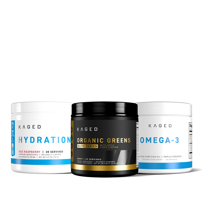 Front view of three KAGED tubs: Organic Greens center, Hydration Red Raspberry left, Omega-3 right on black