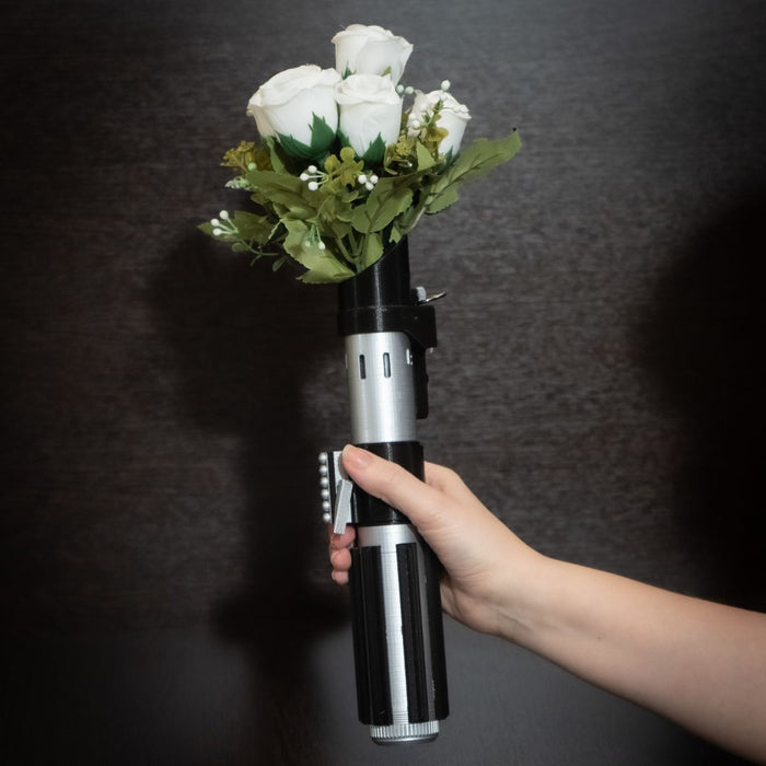 Darth Vader lightsaber hilt used as a Star Wars wedding bouquet holder