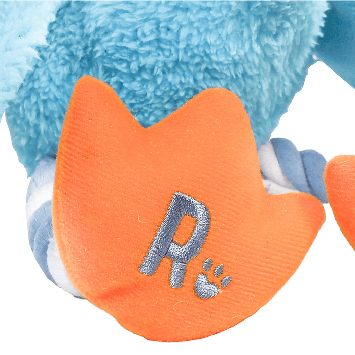 White background with a close up of an orange foot of a baby blue Rosewood Delia duck, with a focus on the Rosewood logo.