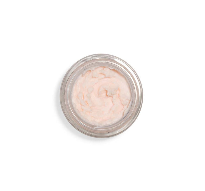 Top view of a light pink creamy mousse in a clear jar, showcasing the texture of Evening Rose Moon Dip® Ageless Facial Sleep Mousse with Peptides + Retinol | Farmhouse Fresh skincare product.