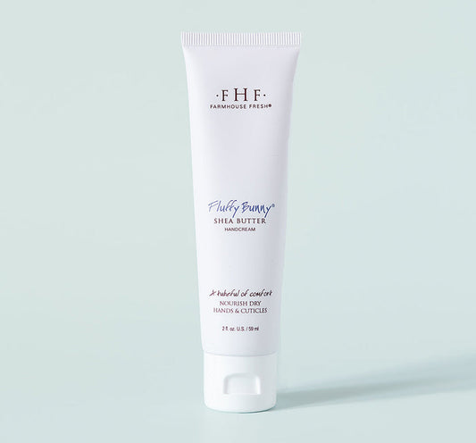 Fluffy Bunny® Shea Butter Hand Cream | Farmhouse Fresh in a white tube designed to nourish dry hands and cuticles, promoting soft and hydrated skin with rich shea butter.