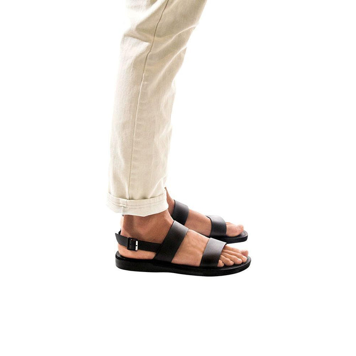 Model wearing Golan black, handmade leather sandals with back strap