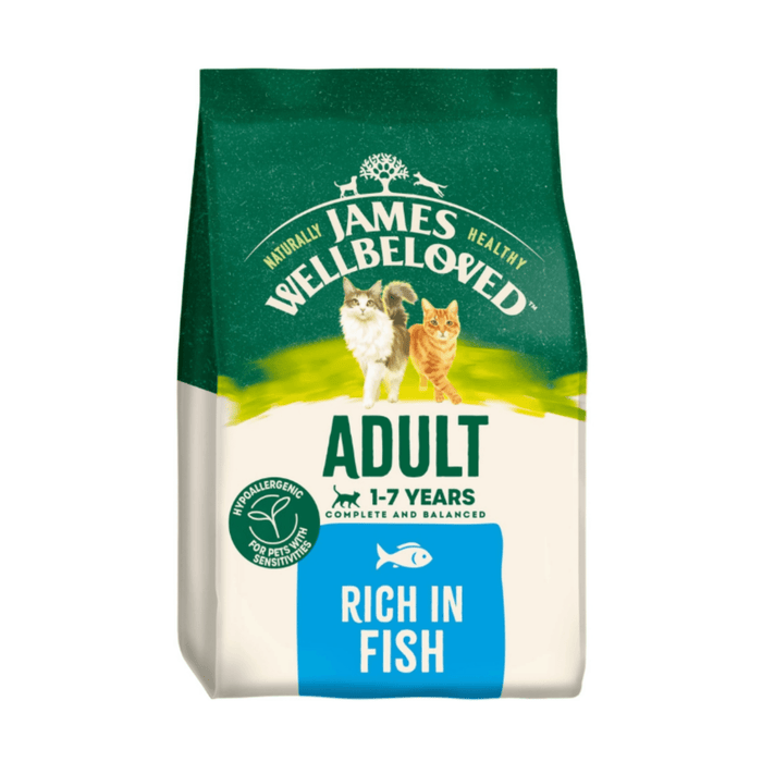White background with a bag of James Wellbeloved Fish Cat Food. Packaging is green and cream with 2 cats pictured, with text 'Adult, 1-7years, Rich in Fish'.