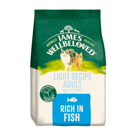 White background with a bag of James Wellbeloved Light Fish Cat Food. Packaging is green and cream with 2 cats pictured, with text 'Light Recipe Adult, 1-7years, Rich in Fish'.