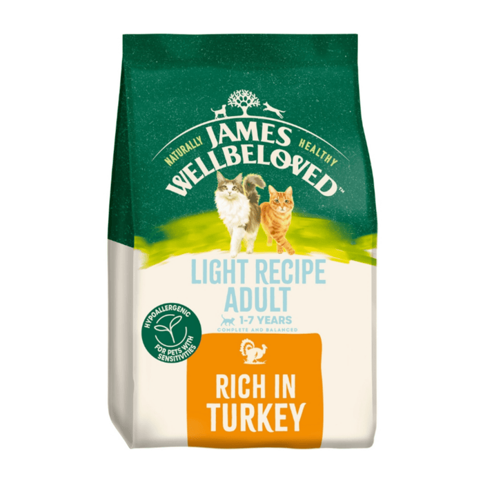 White background with a bag of James Wellbeloved Light Turkey Cat Food. Packaging is green and cream with 2 cats pictured, with text 'Light Recipe Adult, 1-7years, Rich in Turkey'.
