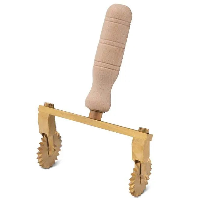 A professional adjustable pasta cutter with two fluted wheels made of brass and a natural wood handle.