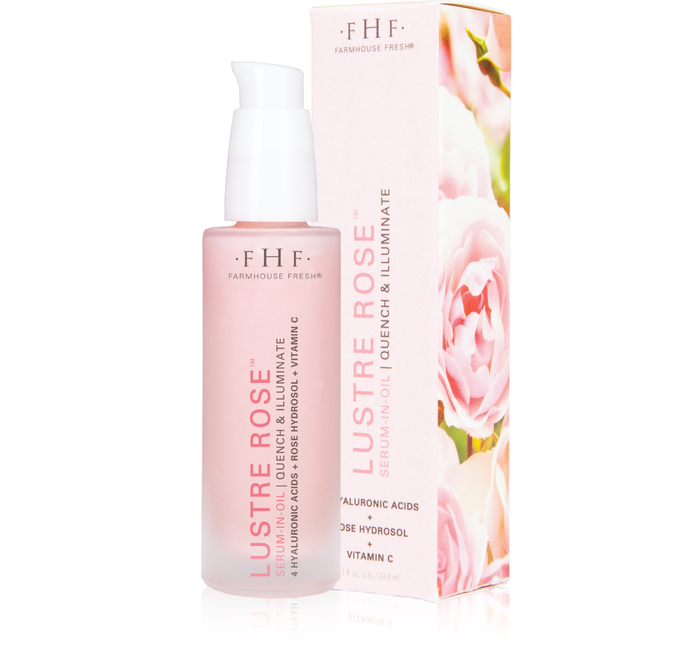 Lustre Rose™ Serum-in-Oil | Farmhouse Fresh in a pink frosted bottle with a white pump, displayed next to its matching floral-themed packaging, highlighting skincare and wellness.