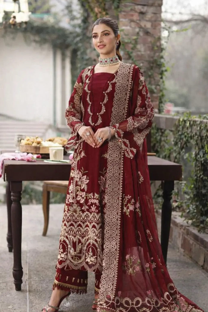Pakistani women's luxury maroon formal dress with cutwork daman.