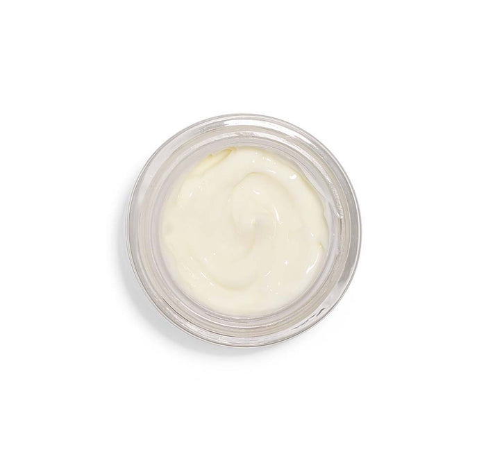 Top view of a creamy, pale yellow gelée in a clear jar showcasing Mighty Brighty™ Vitamin C + Licorice Root Brightening Sleep Gelée | Farmhouse Fresh for skincare and wellness.