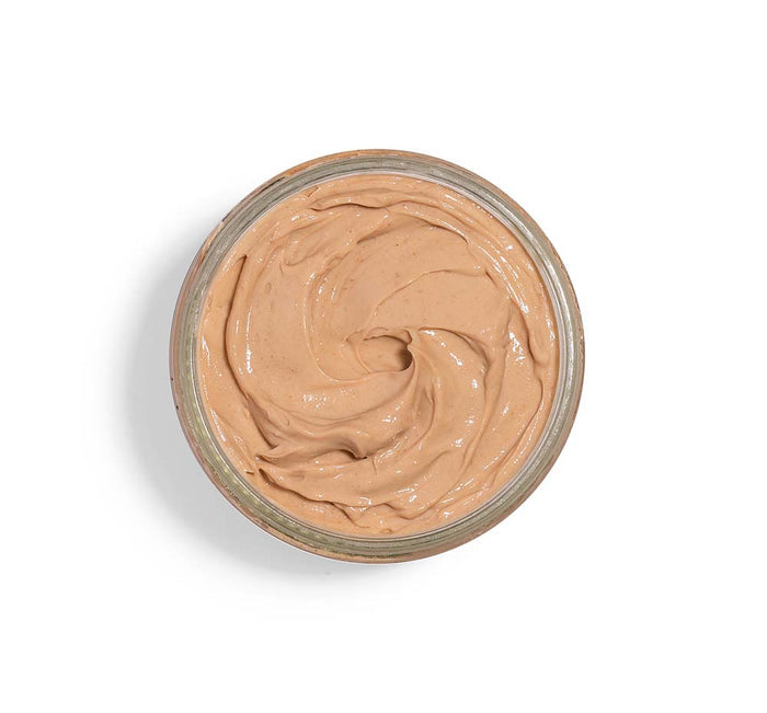 Open jar showing smooth creamy texture of Mighty Tighty® Turmeric & Banana Tightening Mask | Farmhouse Fresh for skincare and wellness.