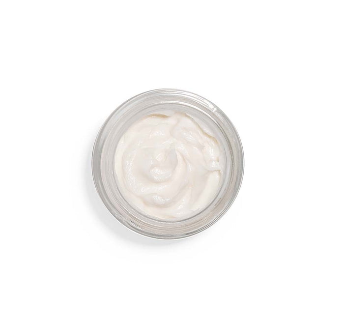 Top view of a jar filled with smooth white facial mousse from Moon Dip® Youthful Complexion Ageless Facial Mousse with Peptides + Retinol | Farmhouse Fresh, showcasing skincare product texture.