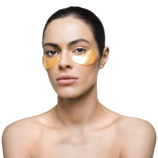 Woman with smooth skin wearing Nanogold Repair Eye Mask - Single | Knesko under her eyes, demonstrating skincare and wellness recovery tools.