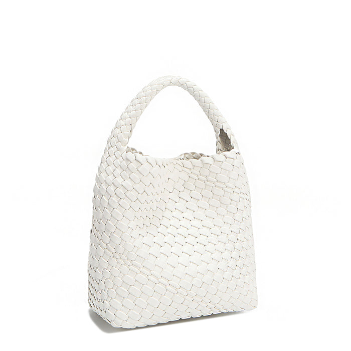 Front angle of Juni handbag crafted in braided vegan leather in classic, timeless white with a top handle (5" drop) and open slip compartment secured with a magnetic snap closure. Slouchy, relaxed silhouette offers a chic and laid-back yet refined look.