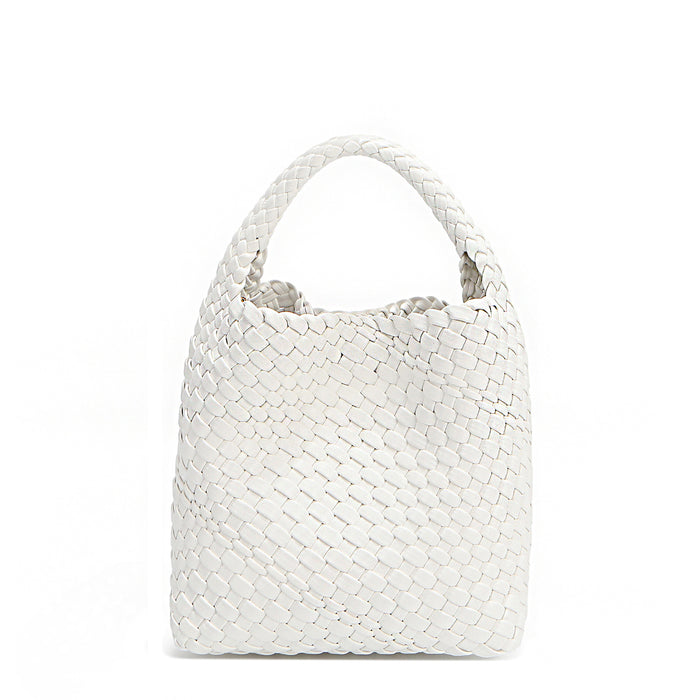 Back of Juni handbag crafted in braided vegan leather in classic, timeless white with a top handle (5" drop) and open slip compartment secured with a magnetic snap closure. Slouchy, relaxed silhouette offers a chic and laid-back yet refined look.