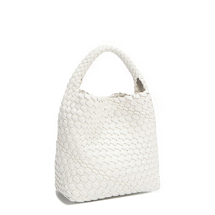 Back angle of Juni handbag crafted in braided vegan leather in classic, timeless white with a top handle (5" drop) and open slip compartment secured with a magnetic snap closure. Slouchy, relaxed silhouette offers a chic and laid-back yet refined look.