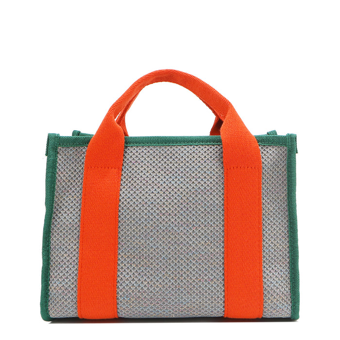 Back view of the Nodu Nadu small canvas Marley tote Bag in gray. Accented with bold orange straps and a forest green trim, this canvas features a subtle metallic shimmer that hits the light whenever you walk for a head-turning detail.