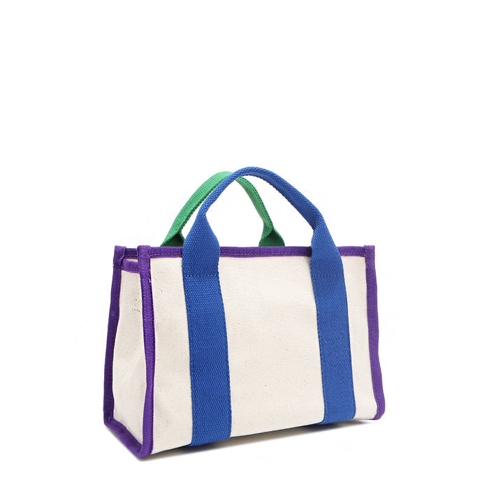 The Rowan bag by Nodu Nadu by Nicole Lee. A bold mix of colors like vivid green, electric blue and vibrant purple trim evoke a sense of fun and lots of personality to mix and match your style. Dual top handles with a 3" drop allow you to carry this statement bag by the top handles.