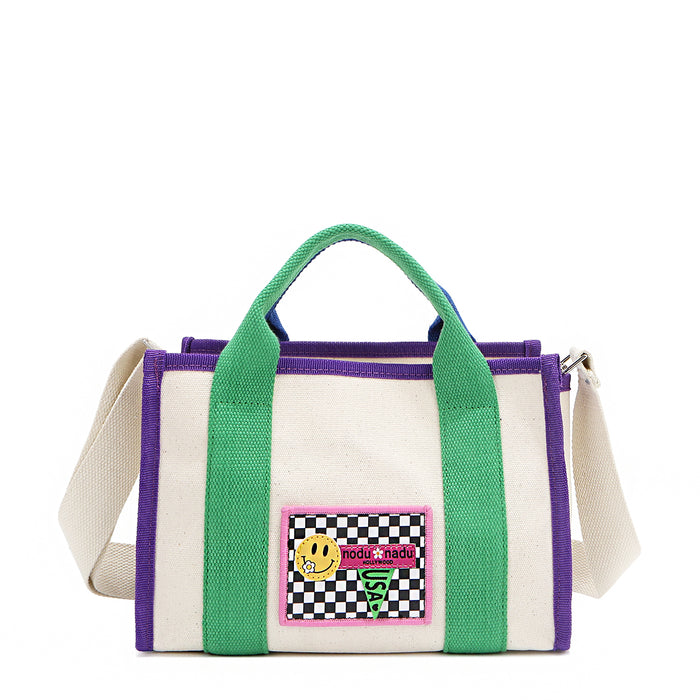 The Rowan bag by Nodu Nadu by Nicole Lee. A bold mix of colors like vivid green, electric blue and vibrant purple trim evoke a sense of fun and lots of personality to mix and match your style. Dual top handles with a 3" drop allow you to carry this statement bag by the top handles or wear it across the body thanks to the optional, adjustable beige shoulder strap!
