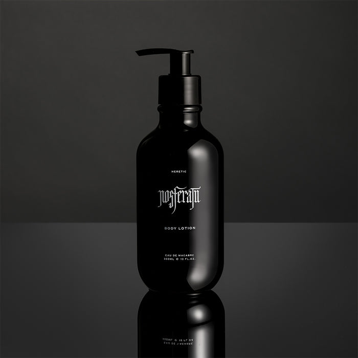 Black Nosferatu lotion bottle with pump on a reflective surface and dark background