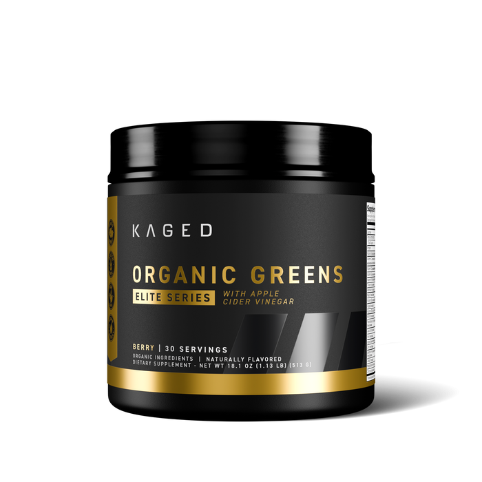 Front view of KAGED Organic Greens Elite tub showcasing 'with apple cider vinegar' callout and berry flavor on black background