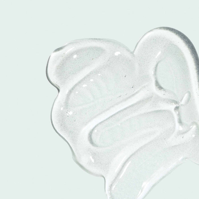 Clear gel texture swatch of ORMIDIC lip enhancement complex | IMAGE Skincare displayed on a light background, highlighting its smooth and hydrating skincare formulation.