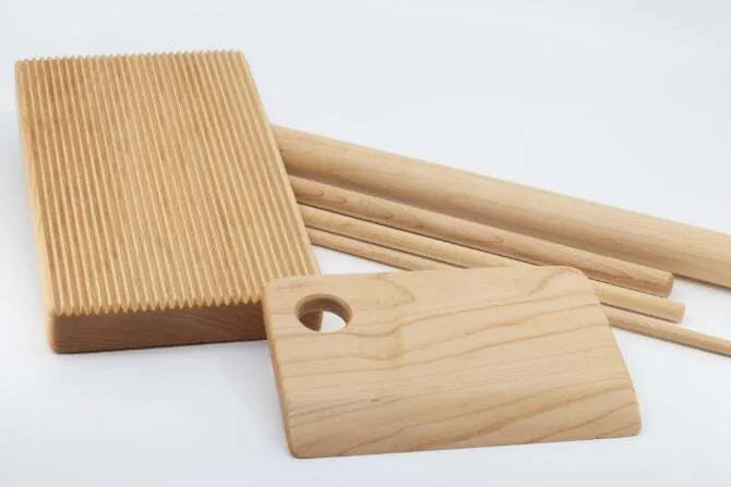 Wooden six piece Pasta Board Set on white background.