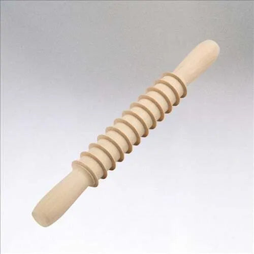 A beige wooden pasta cutter with a rolling pin shape, designed for cutting Pappardelle pasta.