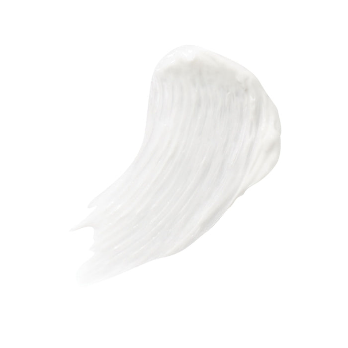 Close-up of a white creamy texture smear representing Purelash Lash Extender & Conditioner | Jane Iredale, a skincare product for enhancing eyelash health.