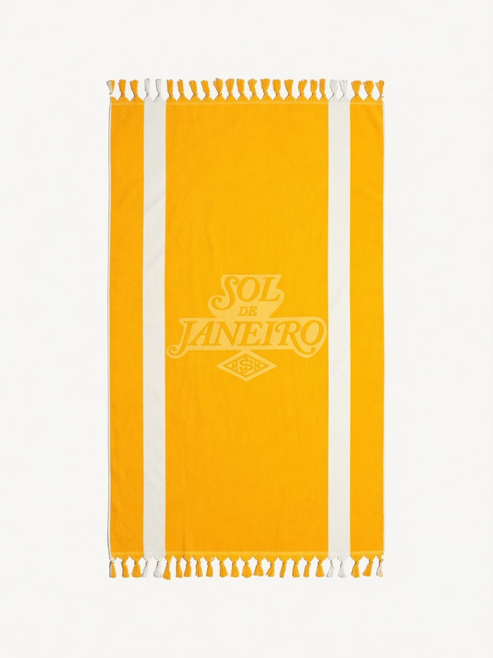 Sol de Janeiro Badalada Beach Towel with vibrant tropical print, soft fabric, perfect for beach or poolside relaxation.