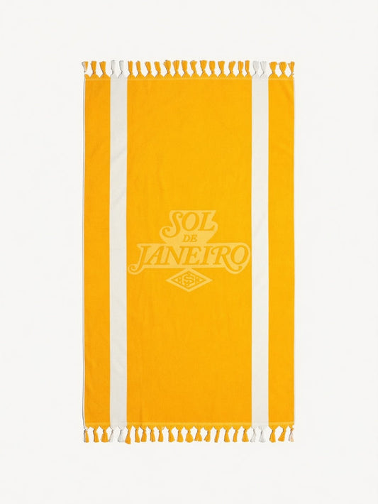 Sol de Janeiro Badalada Beach Towel with vibrant tropical print, soft fabric, perfect for beach or poolside relaxation.
