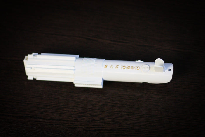 Elegant geek wedding accessories: pure white lightsaber flower handle