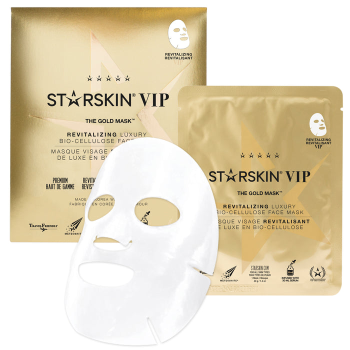 STARSKIN The Gold Mask™ VIP revitalizing coconut bio-cellulose face mask draped on a model’s face for skin rejuvenation.