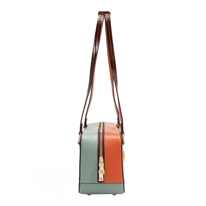Our Sun and Sand Shoulder Handbag. Side view set on a white background