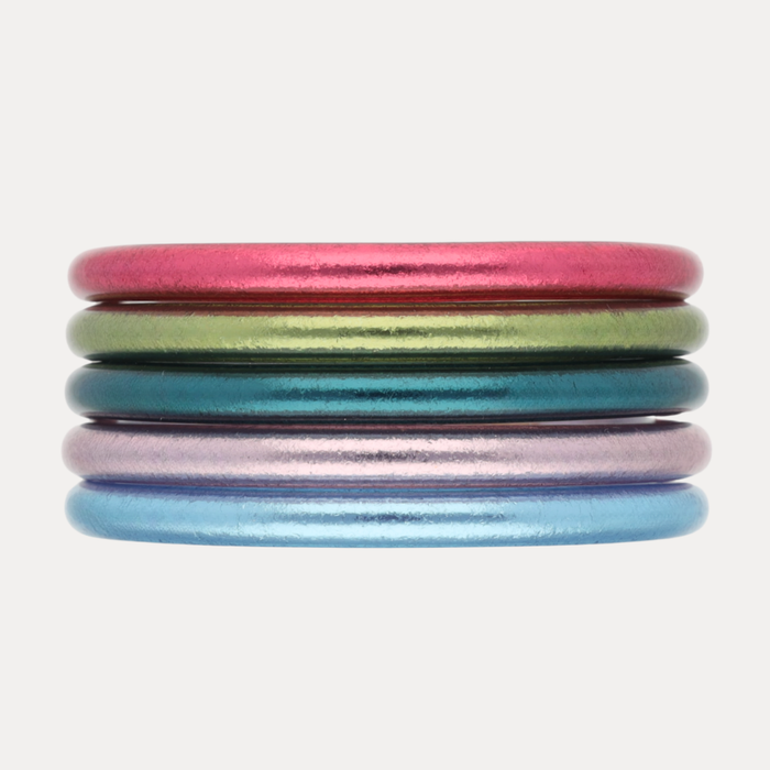 The Nantucket Stack: vibrant coastal-themed bangles in pink, green, blue, and shimmering hues.