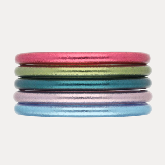 The Nantucket Stack: vibrant coastal-themed bangles in pink, green, blue, and shimmering hues.