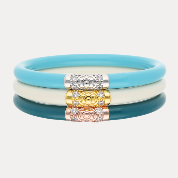 The Teal Tidal Luxe Stack featuring turquoise and ivory bangles with gold and rose gold accents.
